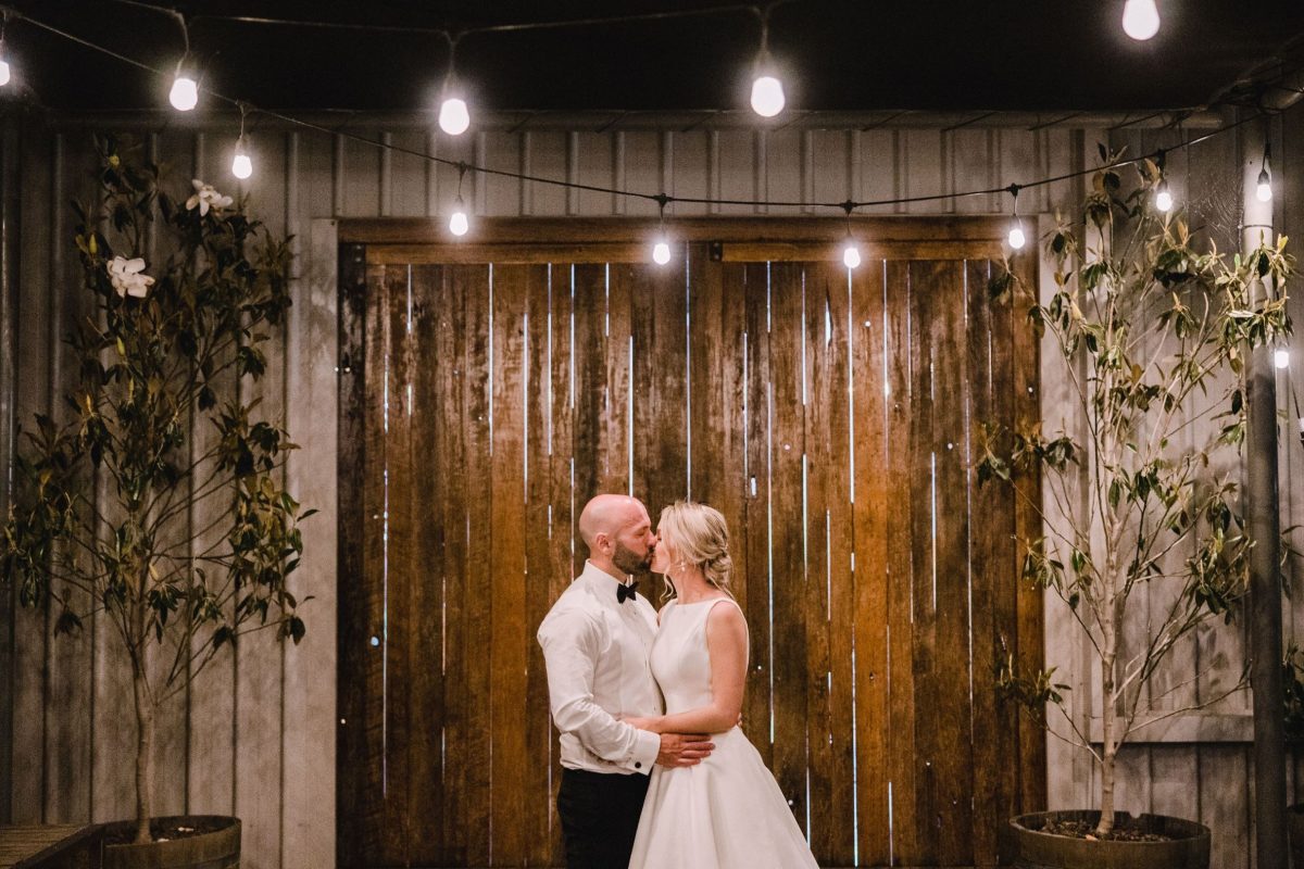 Married couple kissing at Tallagandra Hill Winery