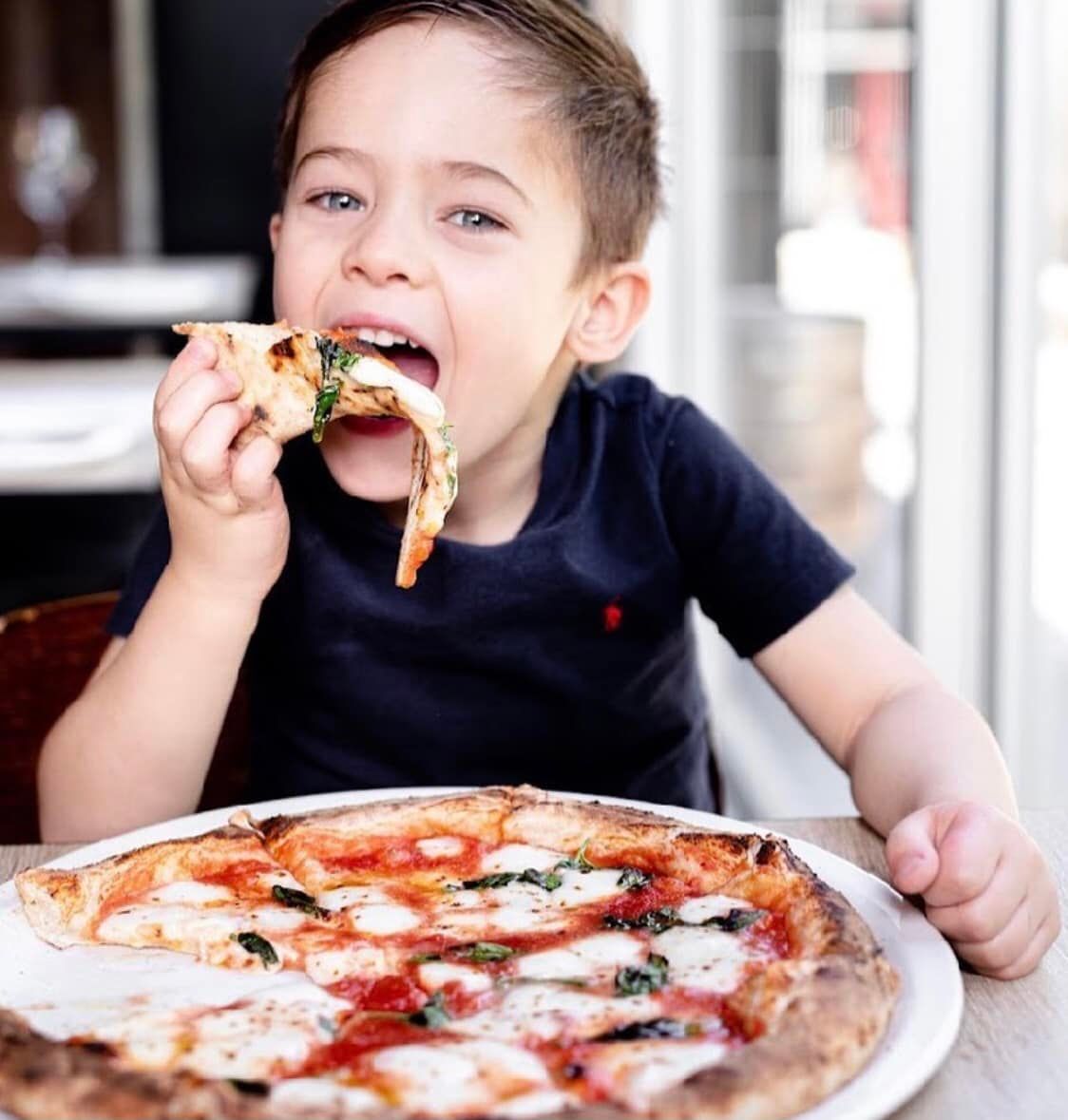 boy eating pizza