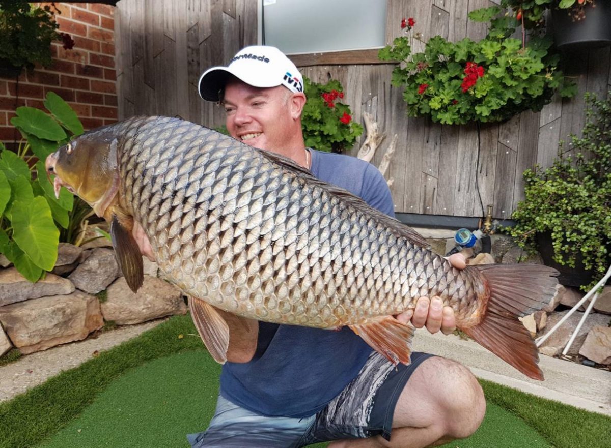 Man holding carp