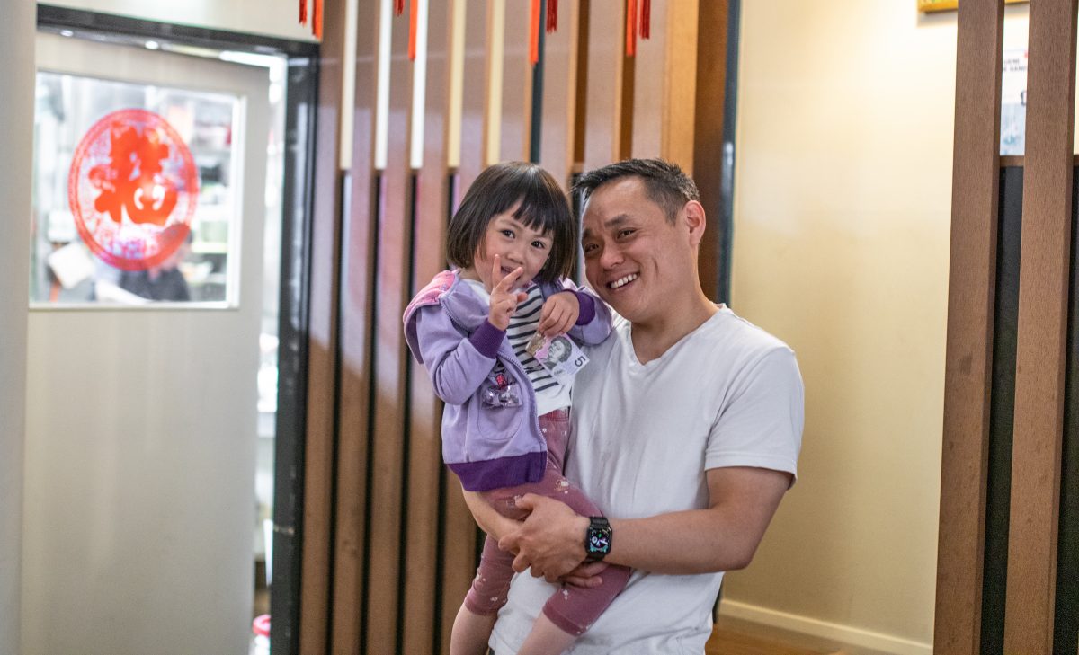 Gavin Chan holds youngest daughter Jennifer. 