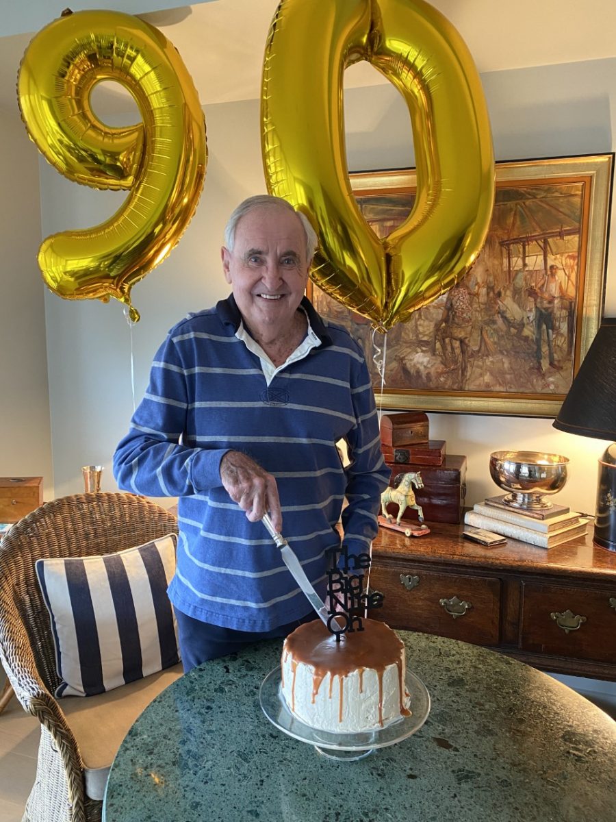 Man cutting birthday cake