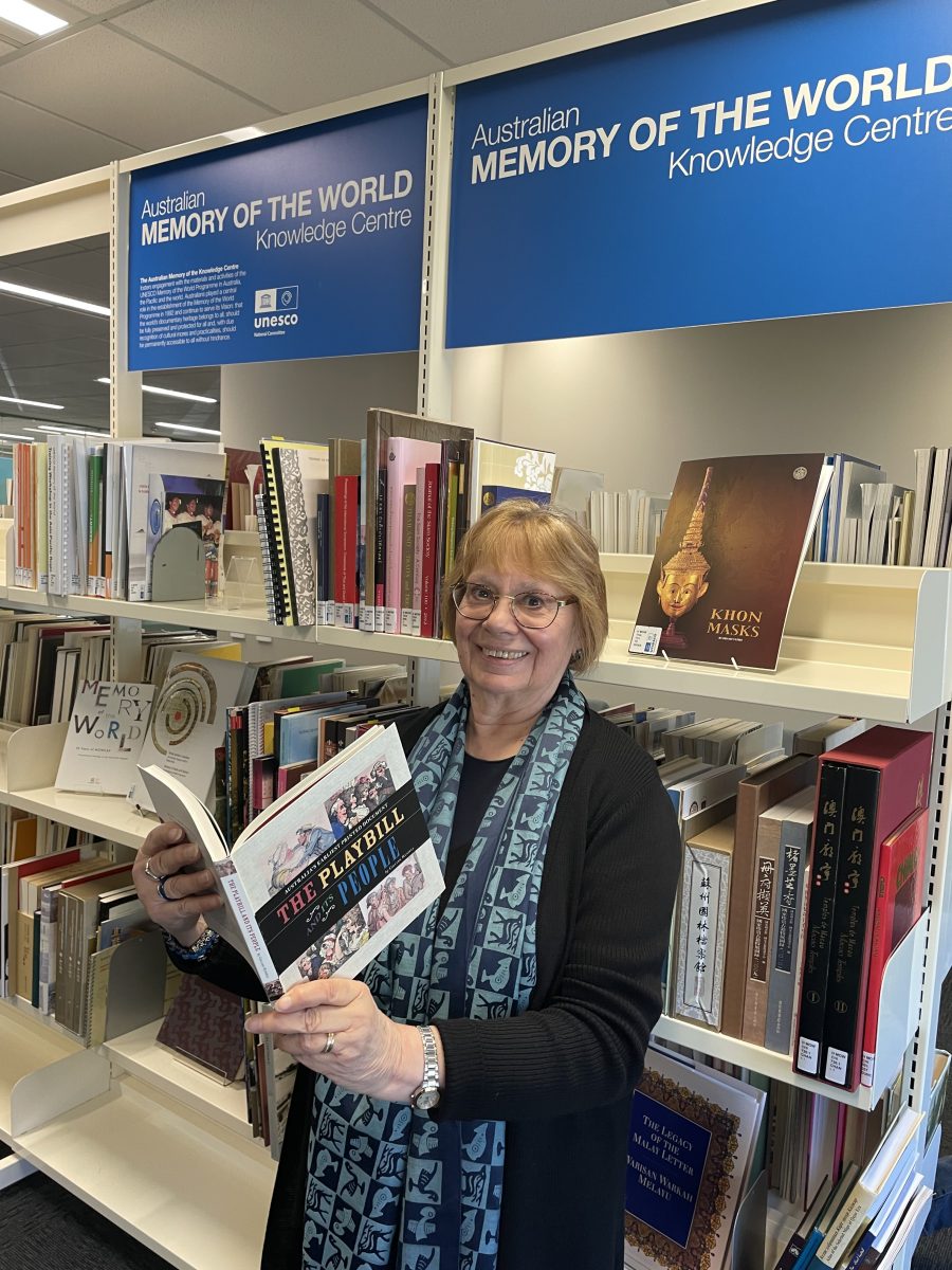 Roslyn Russell reads a book at the Australian Memory of the World Knowledge Centre