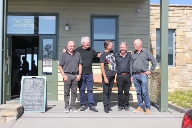 Five men outside pub