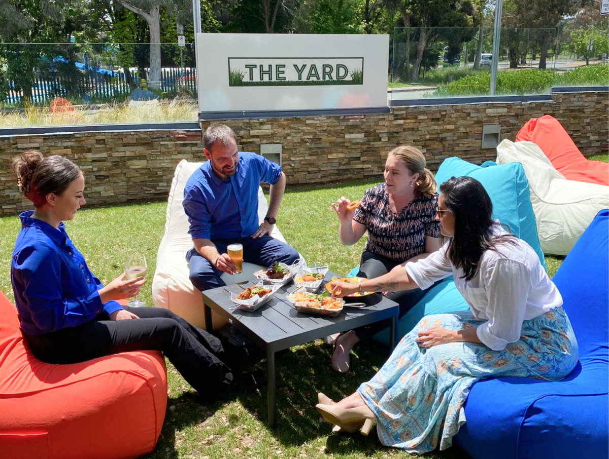 people sitting on bean bags eating food