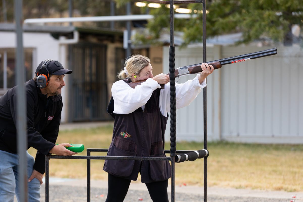 Woman firing a gun