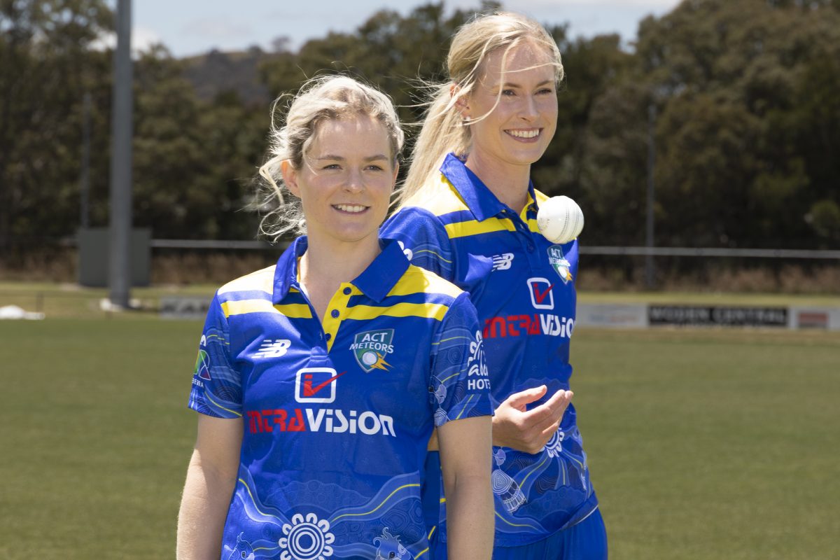 two female cricketers in uniform