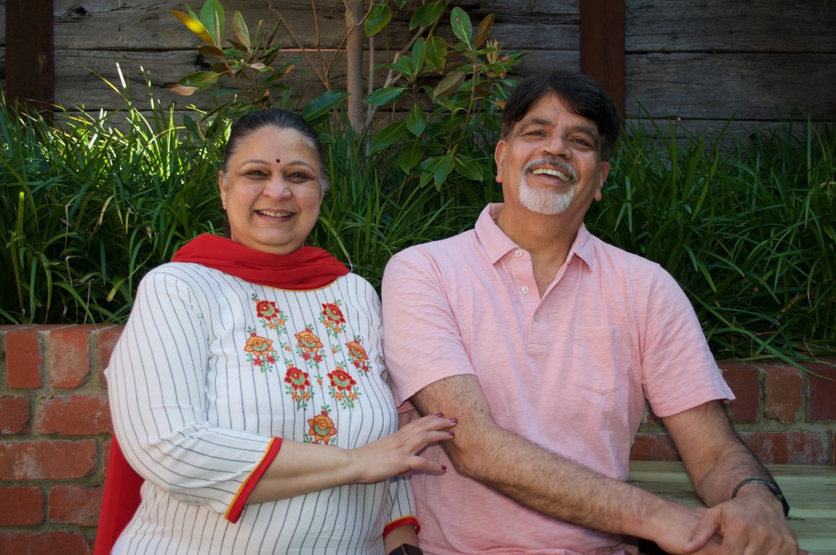 Wife and husband smile at the camera