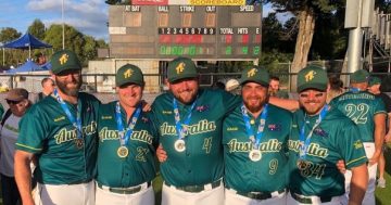 Influence of late softball legend lives on as son, grandson help clinch Australia's second world title
