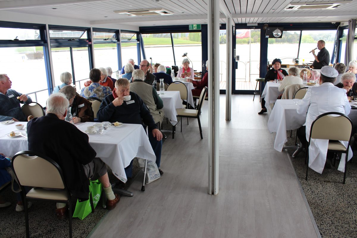 inside shot of the MV Southern Cross with passengers sitting down for morning tea