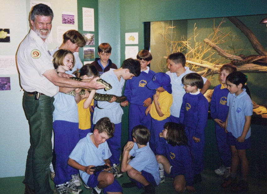 Ross Bennett shows school children some reptiles