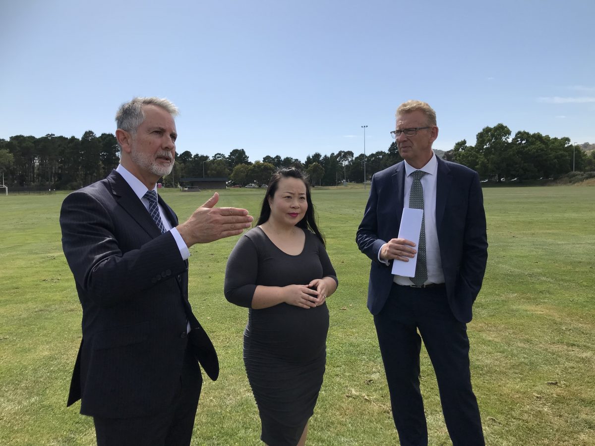 Jeremy Hanson, Elizabeth Lee and Mark Parton talk in a parkland