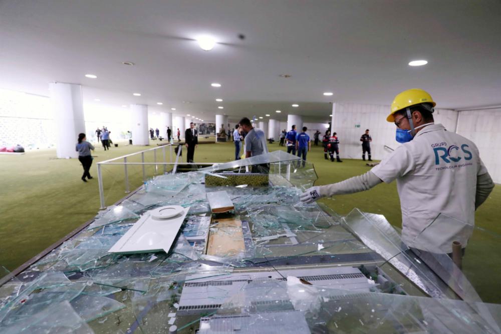 workers repair damaged building interior