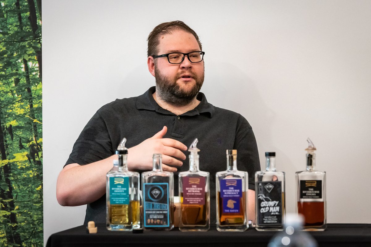 Man with bottles of whisky