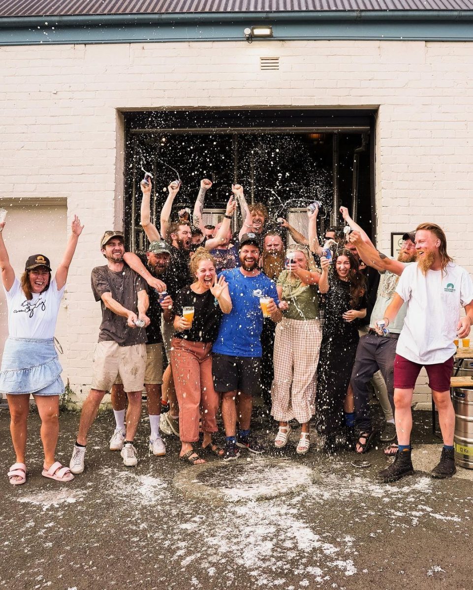 group of people celebrating with beer