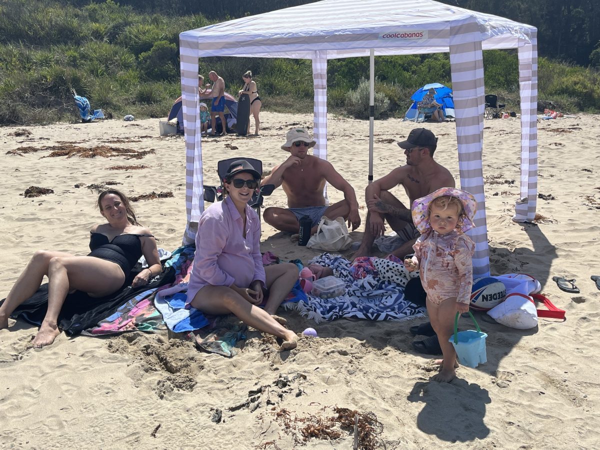 Family under a cabana on Barlings Beach