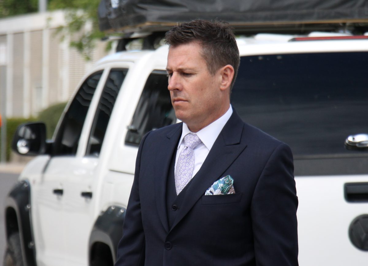 man in suit leaving court