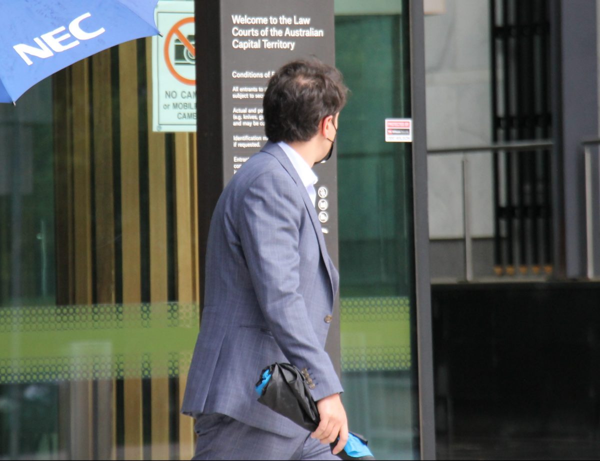 Man in suit leaving court