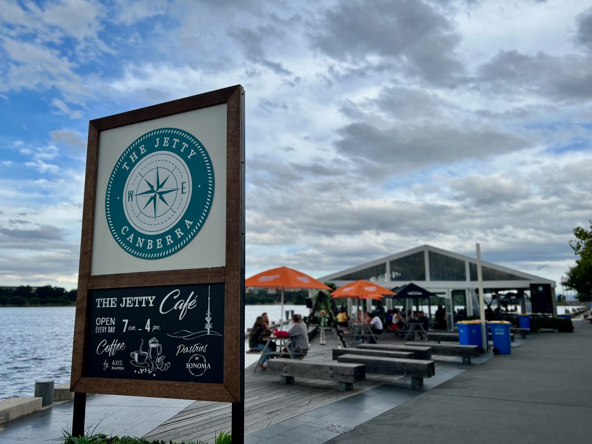 Jetty sign with outdoor tables