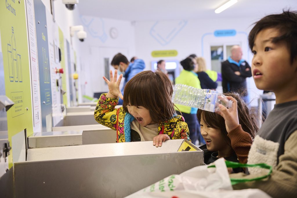 Children with recyclable items