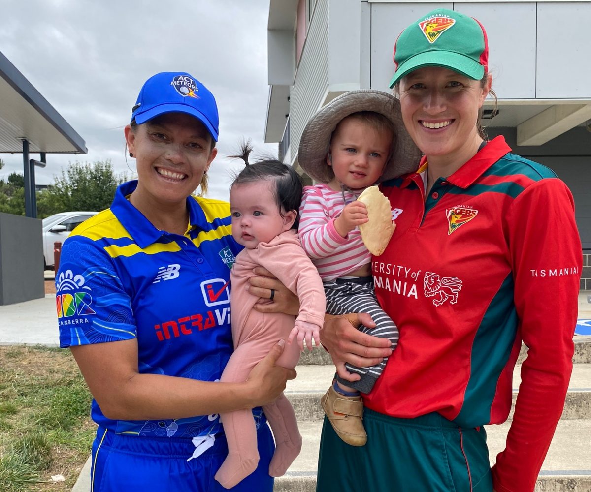 ACT Meteors cricketer Angela Reakes with her daughter Winnie and Emma Thompson-Flint