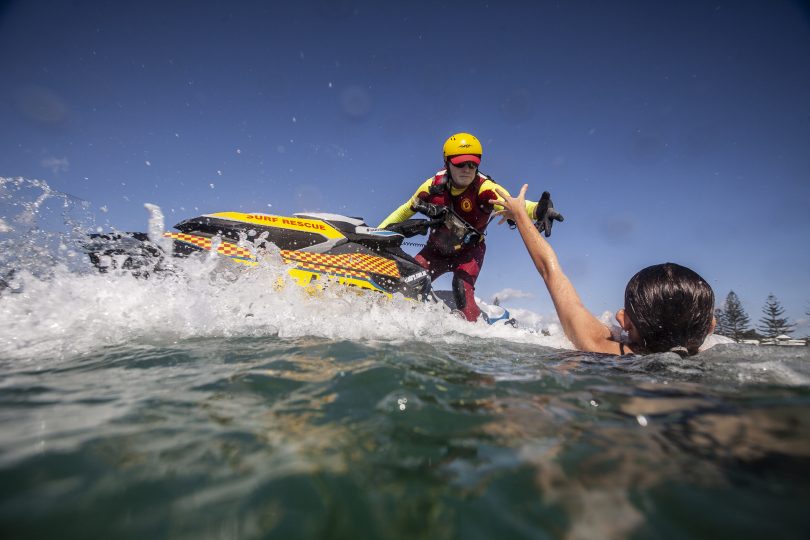 person being rescued in the surf