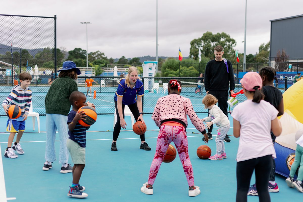 children bouncing basketballs 