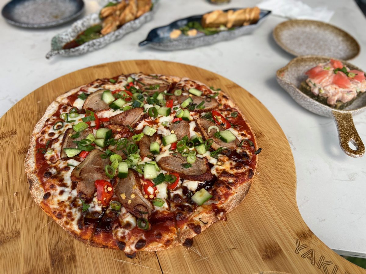 Peking Duck Pizza on wooden board at Yaki Boi Brraddon