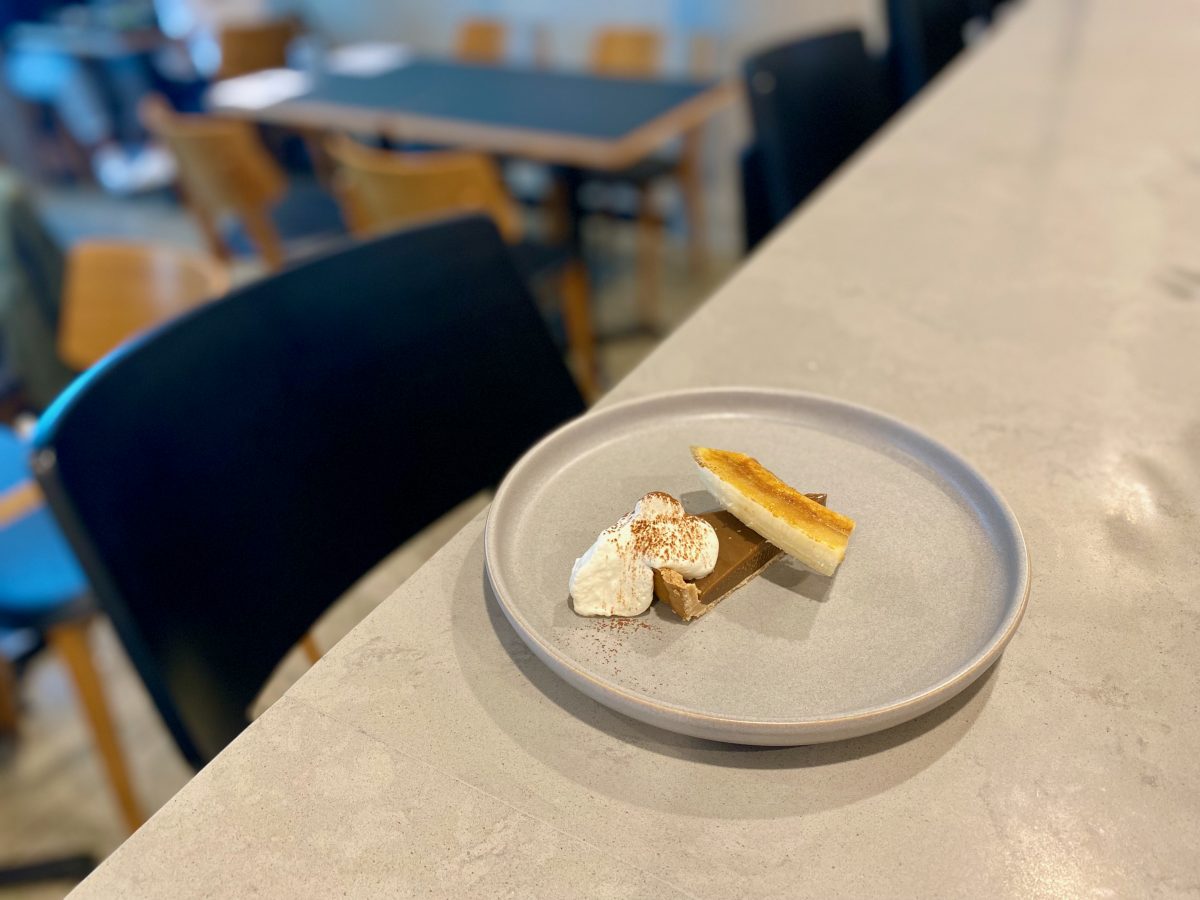 Wedge of pie with whipped cream and caramelised banana.