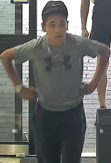 Boy in cap entering a shop