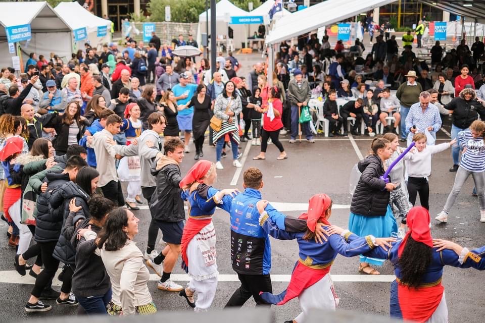 People dance at a fair