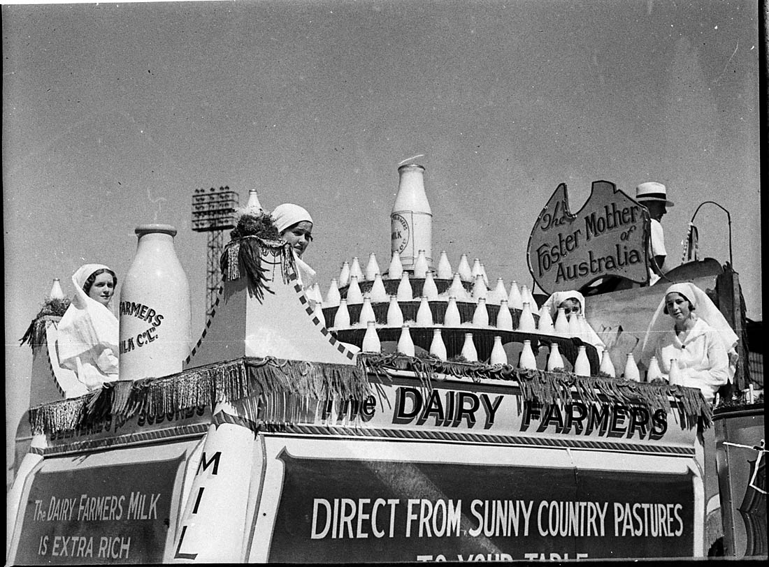 Old photo of mothers on top of milk truck