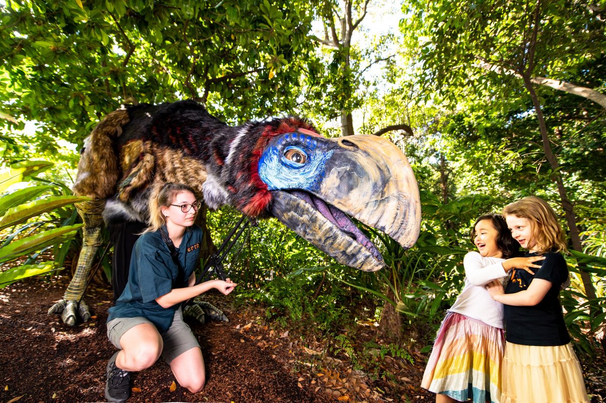 Thunderbird dinosaur puppet with children