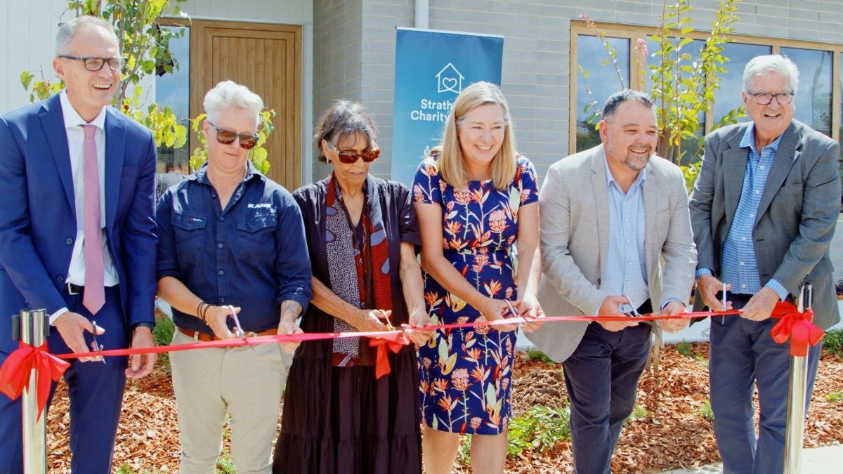 People cutting ribbon