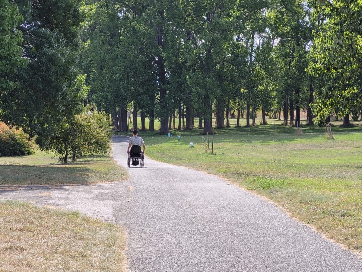 person in a wheelchair on the Curtin bike path