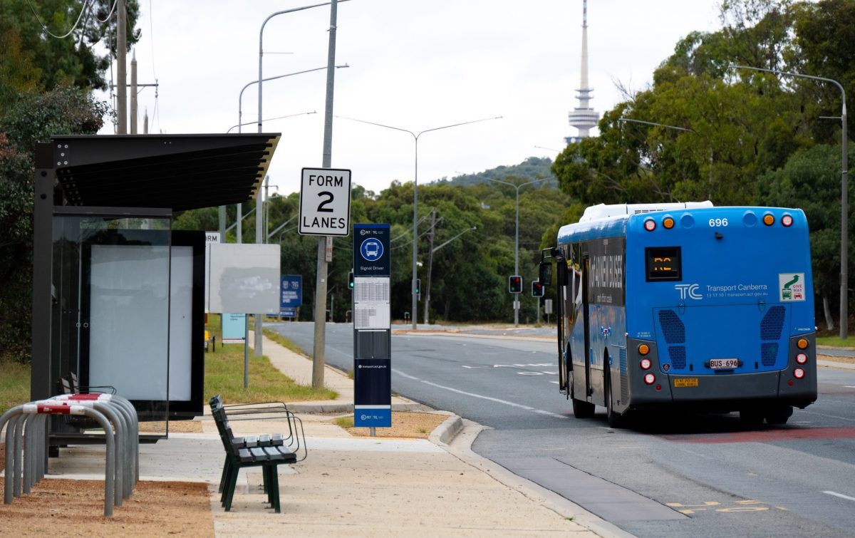 bus passing empty bus stop