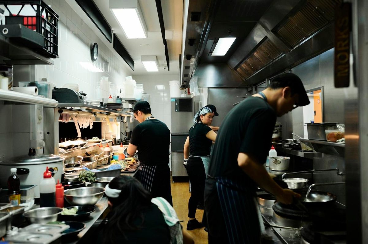 restaurant kitchen staff preparing orders