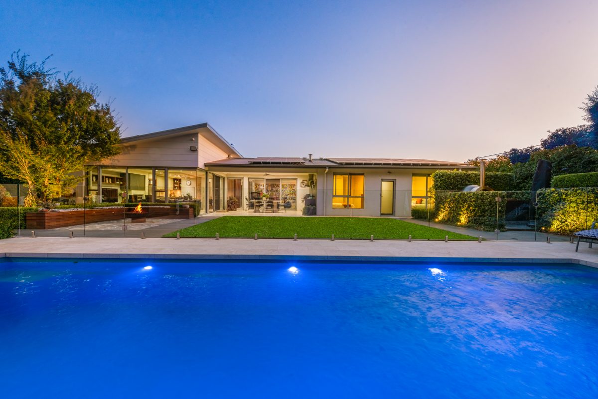 A view of the outdoor living area, overlooking the property's large pool