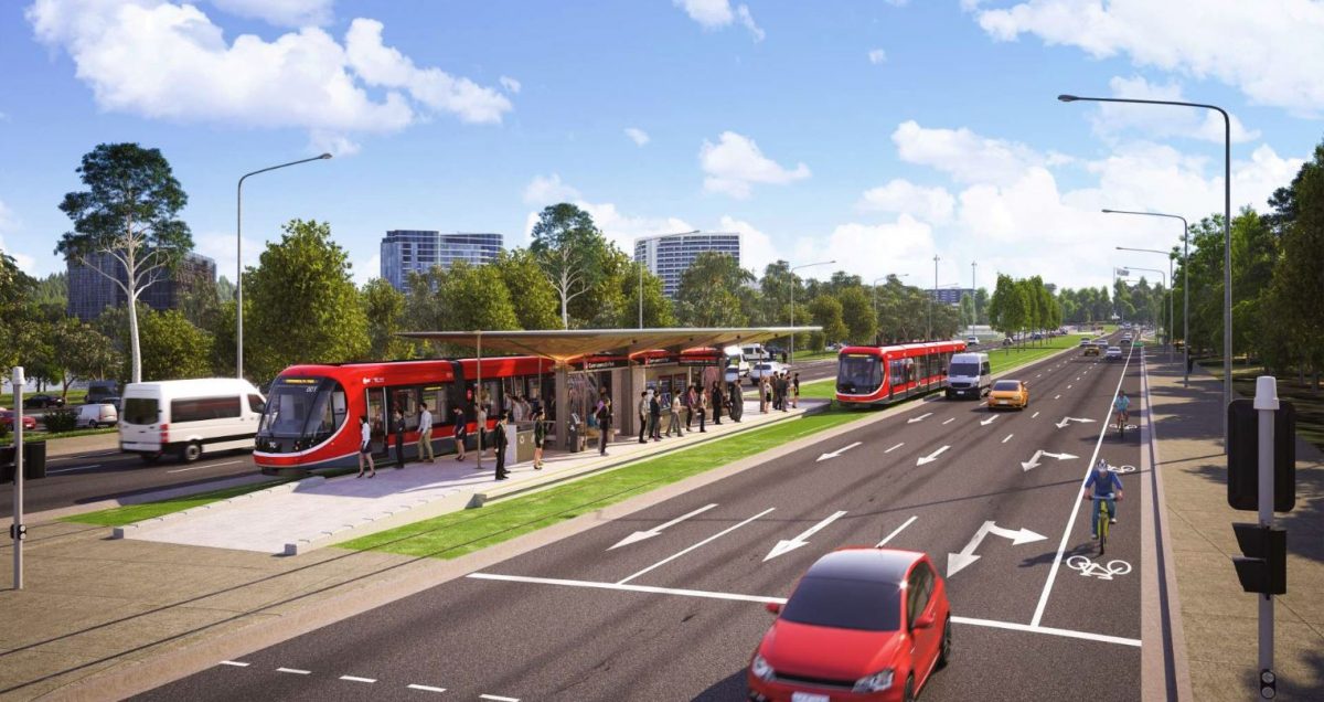 The Commonwealth Park stop with grassed sections and trees in the median