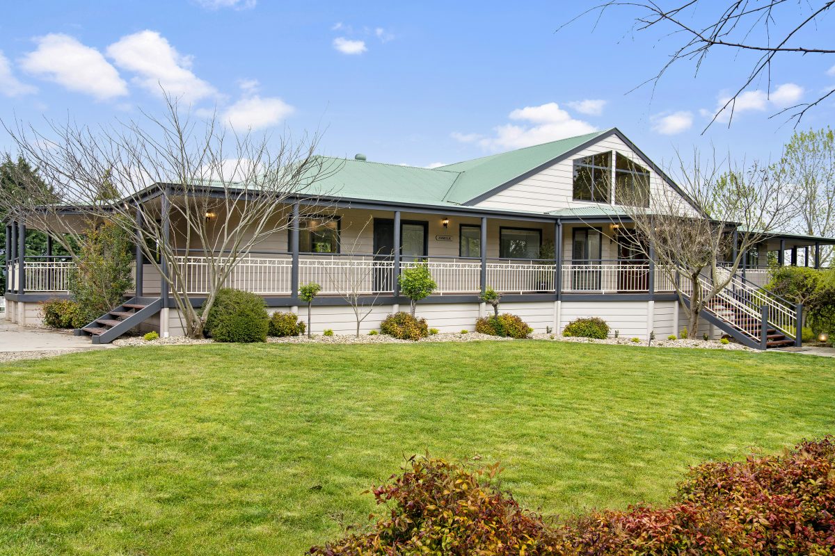 country house on a property with large lawn