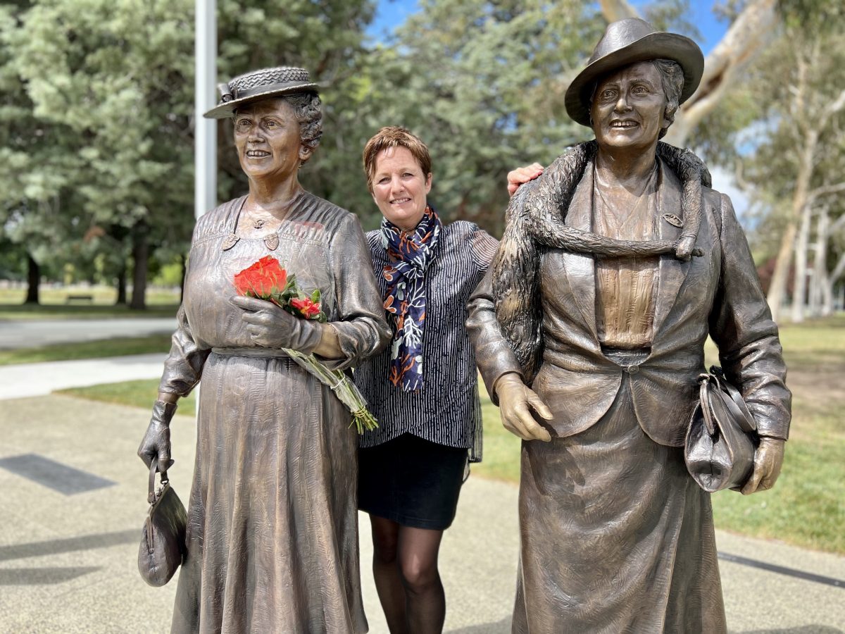 Lis Johnson with her two sculptures of female politicians