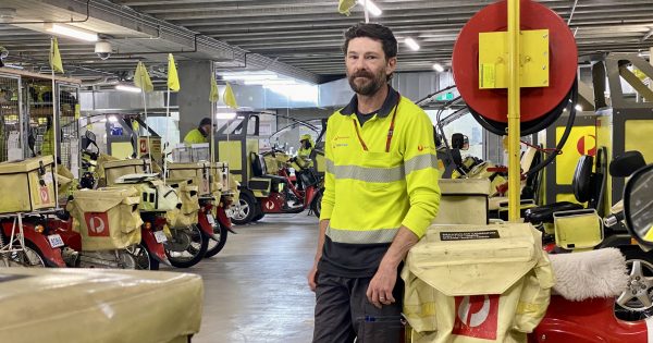 Odd jobs: Peter the postie delivers mail and spreads smiles across Canberra, one prickly bush at a time