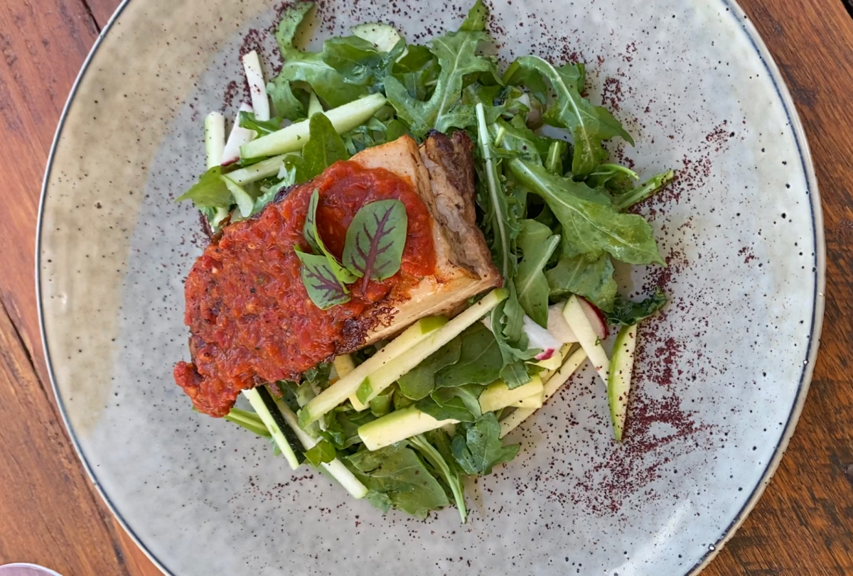 Pork belly with apple salad plated up at Lerida Estate