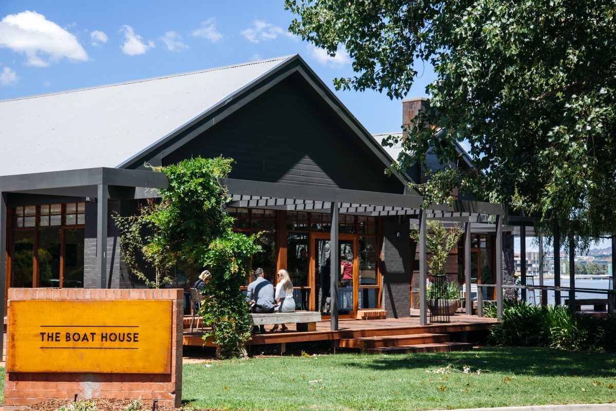 Exterior of the boat house with sign