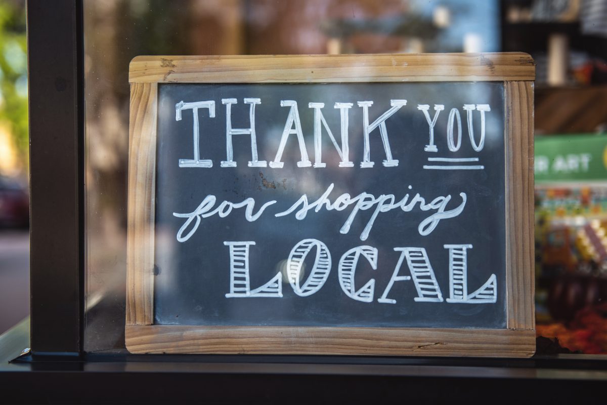 Chalkboard saying 'thank you for shopping local'