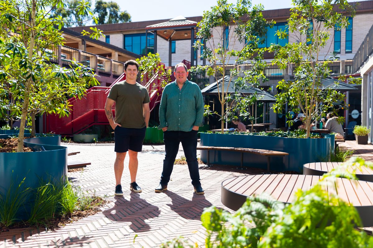 Hugh Swann and Julian Raxworthy stand in front of the refurbished UC Hub.