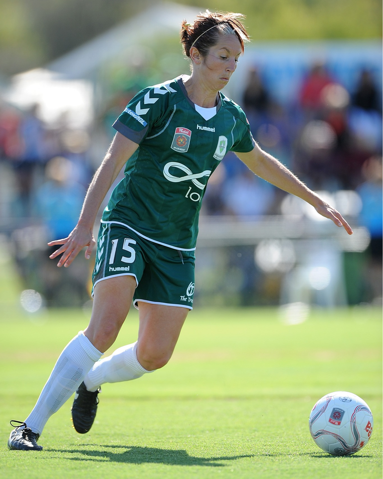 woman playing soccer