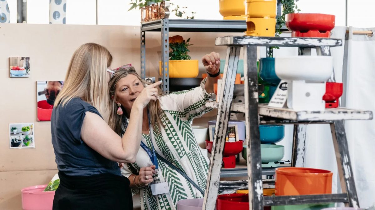 People browsing market stall