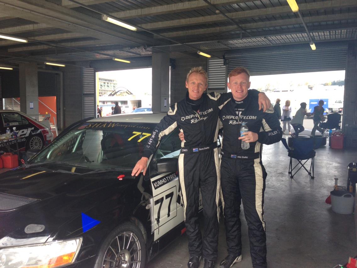 Steve Shelley and his sone Jake next to a race car