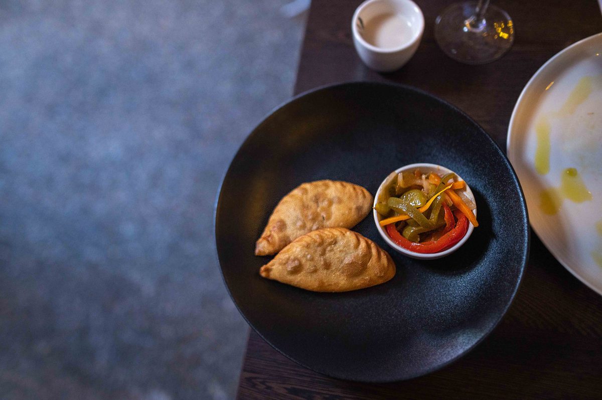 lamb and beef-filled dough pockets on a plate