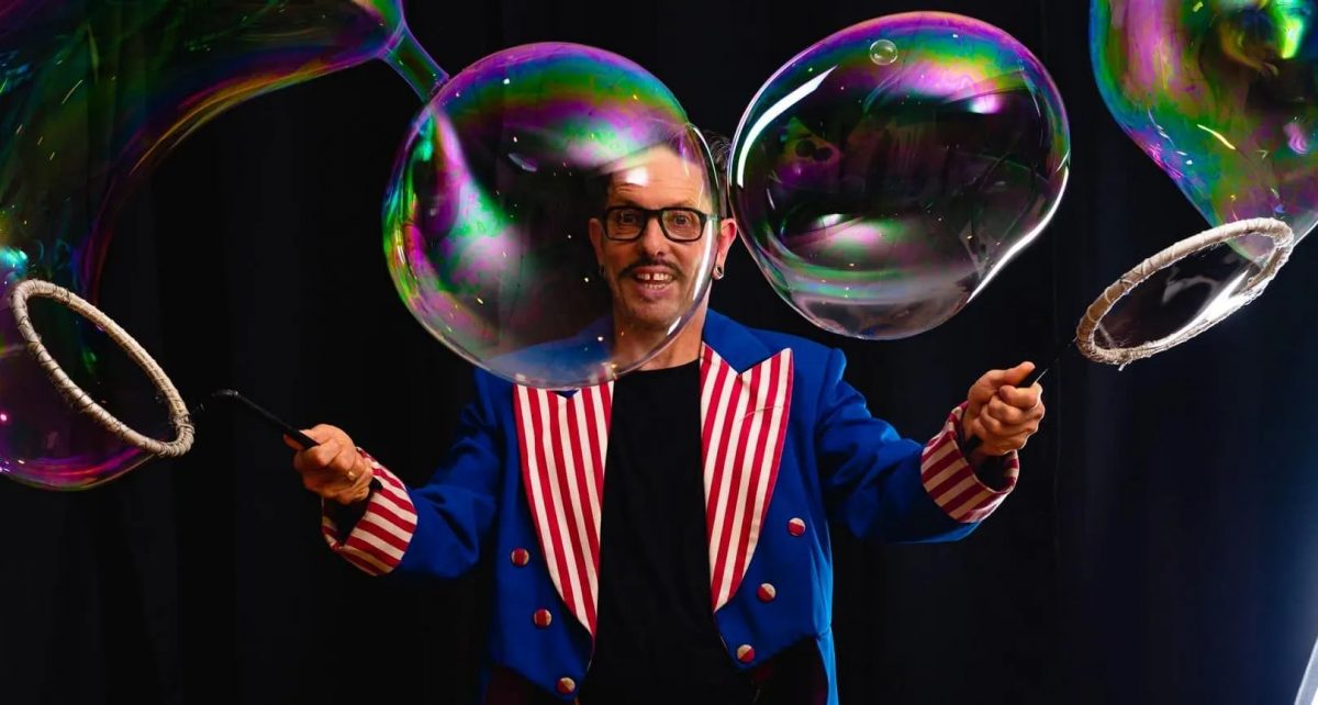 Man in suit with large bubbles around him
